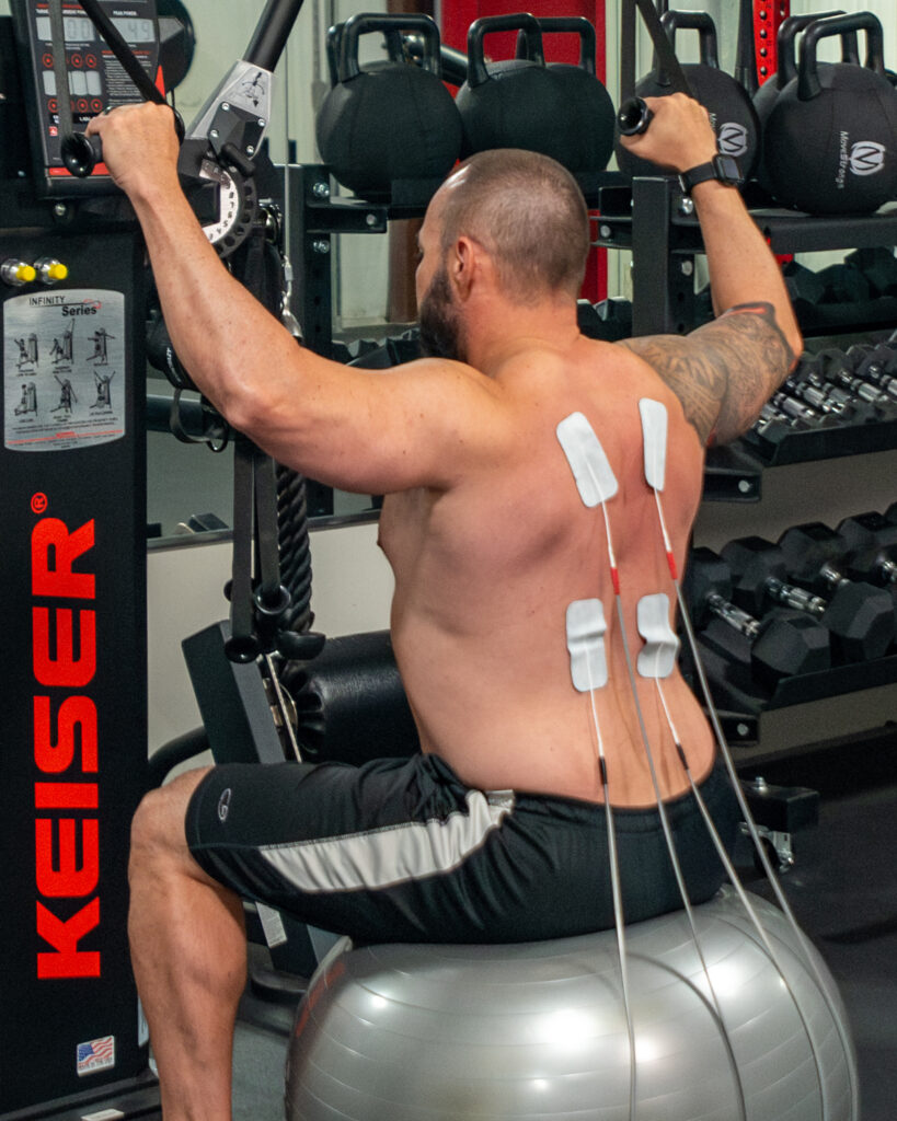 man being monitored at weight machine