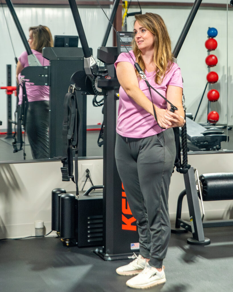 woman at weight machine